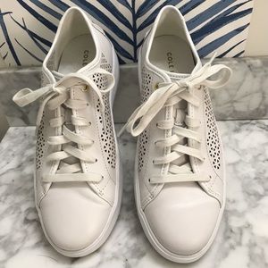 Cole Haan white perforated leather sneakers.